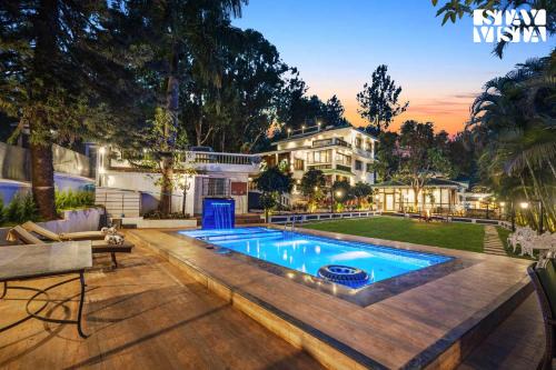 StayVista's Grace & Light - Hill-view villa with Outdoor pool, Terrace & Games room