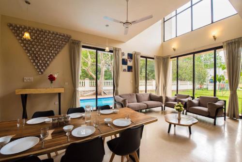 StayVista's Greenwoods Villa 10 - City-Center Villa with Private Pool, Terrace, Lift & Carrom Board