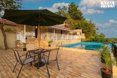 StayVista's Harvest Haven - Pool-View Villa with Deck & Machan near Sula