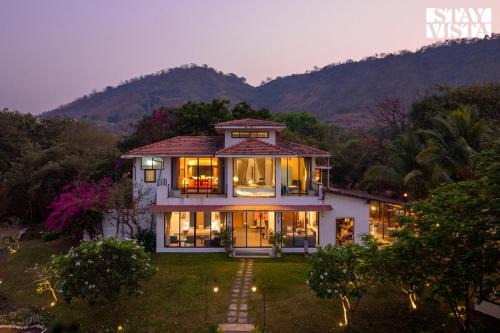 StayVista's House Below The Hill - A stylish Mountain-view villa with Pool and Games room