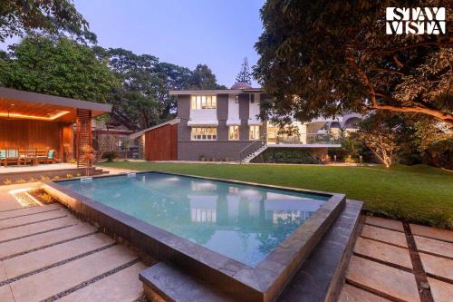 StayVista's House Of J - Embrace Leisure with Lawn, Pool, and Gazebo