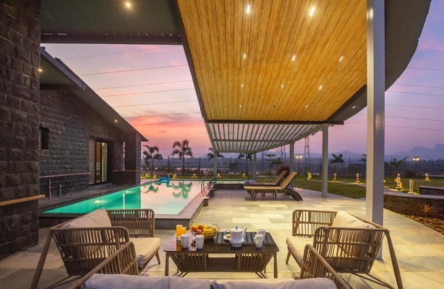 StayVista's Le Ciel - Lakeside Retreat Amidst Farmland with Pool, Indoor Activities, Lawn, Bonfire Pit & Ample Seating Space