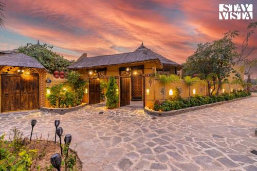 StayVista's Majestic Mud House - Rajasthani Architecture with Modern Amenities, Outdoor Pool, Adventure Activities, and Spa