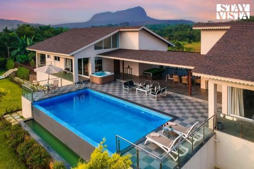 StayVista's The Tavern At Canary Farms - Mountain-View Luxury Mansion with Infinity Pool & Games Zone