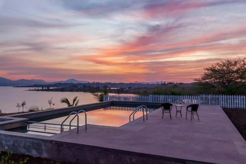 StayVista's Volendam Acres - Lake-View Villa with Pool, Amphitheatre & Turf