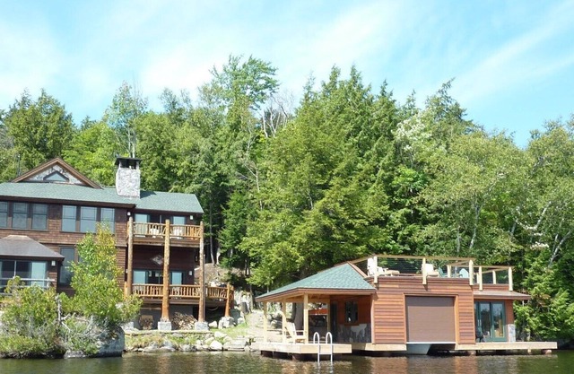 Stunning timber frame lake house with boathouse, game room. Sleeps 10.