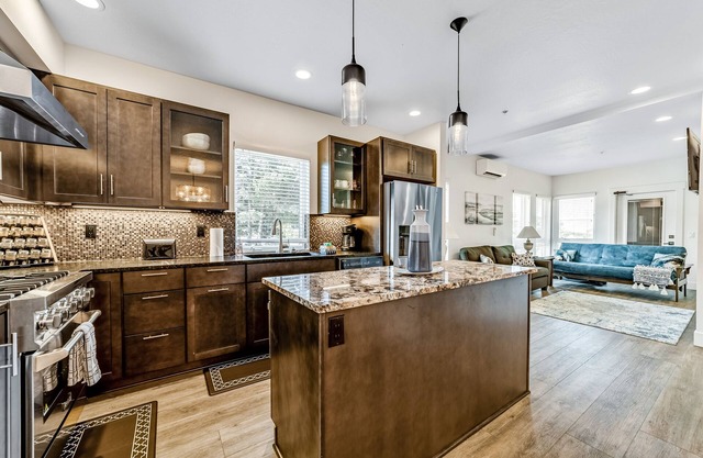 Sunny apt with fireplace, partial water views, washer/dryer, grill & AC