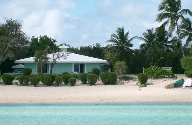 The Barefoot Beach House sits on a sandy beach