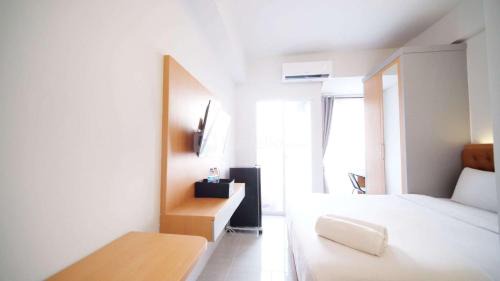 Tidy and Cozy Stay Studio Apartment at Suncity Residence By Travelio