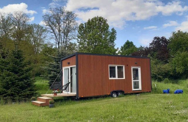 Tiny house in the middle of the village, tiny house in the countryside, the church bells wake you up