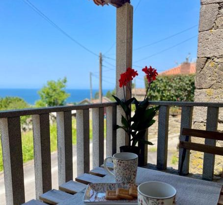 Tiny house with sunset over the ocean