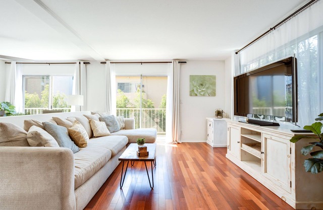 Two bedroom Townhome with huge private yard, patios, laundry, & garage parking!