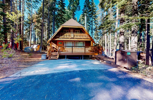 Two-story cabin with a wood fireplace, washer/dryer, & decks