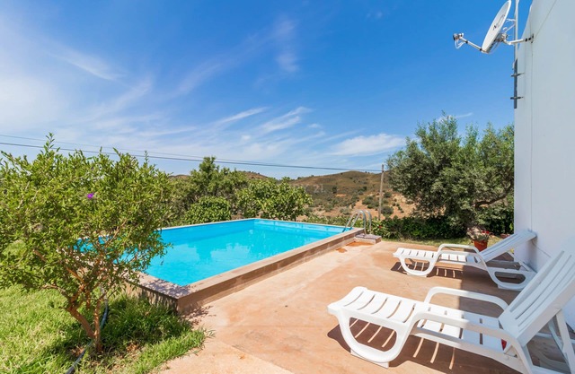 Typical house between sea and mountains