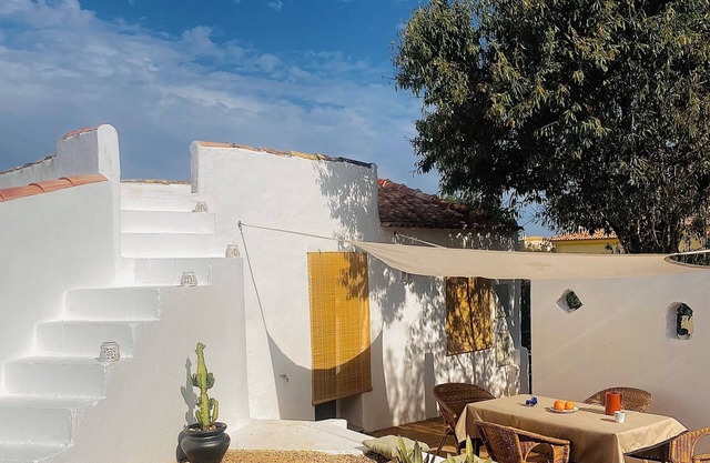 Typical Algarve cottage with tepee in garden Shaded by carob trees
