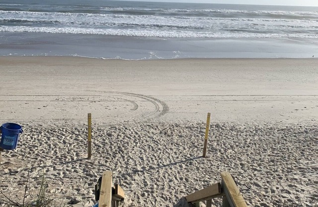 Unit in coveted Oceanwalk complex steps from the ocean with partial ocean views