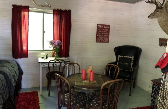 very private,adorable rustic cabin -out house , full shower house off barn