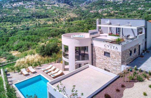 VILLA CVITA is a modern 5-bedroom villa with a Jacuzzi, a Gym and Finnish Sauna, a heated pool, and amazing views