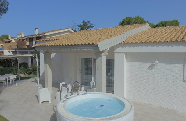 VILLA Via Marina IKEBANA Porto Pino, prestigious and finished seaside villa