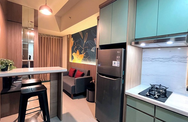 Warm And Homey 2Br At Vida View Makassar Apartment