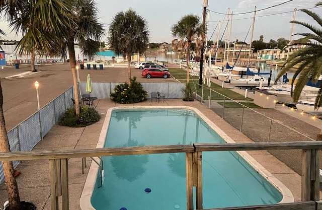 Waterfront 2 bedroom condo with pool, boat ramp and slips