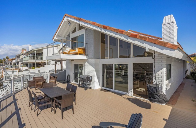 Waterfront home with kayaks, grill, Pac-Man, AC, balconies, & smart TVs