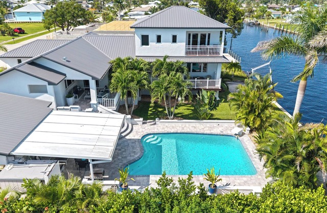 Waterfront Paradise with heated saltwater pool and amazing views gulf access