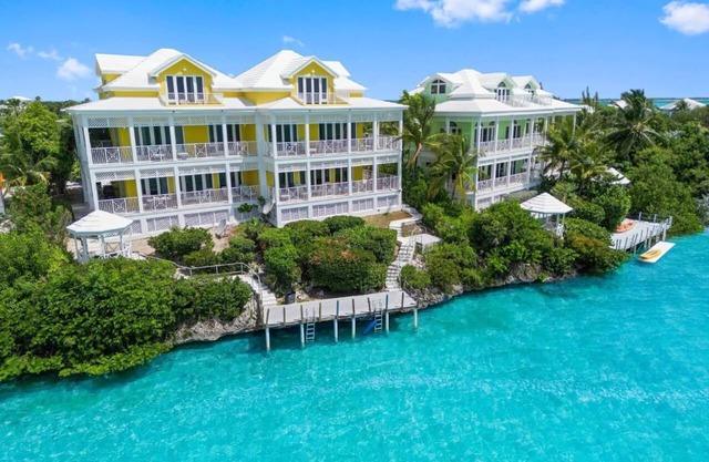 Waterfront Villa with Dock, Walk to Beach Club & Rusty Anchor Rest. 3b/r 3.5b/a