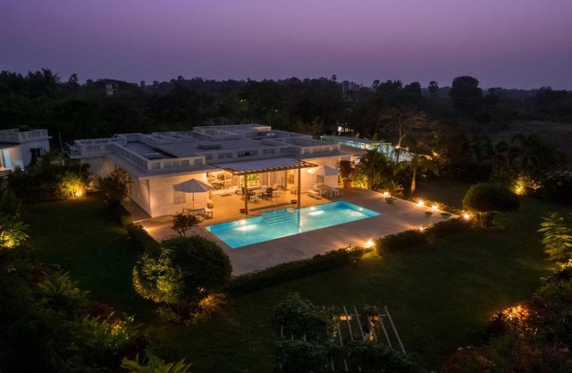 Whispering Palms by StayVista - Pool-view villa with Boutique interiors, Terrace & Lawn