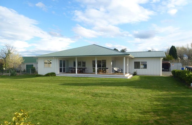 House amoungst a vineyard and orchard