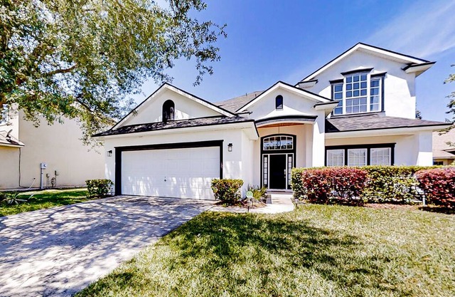 Waterfront 2-story home with water views, patio, streaming, washer/dryer, & AC